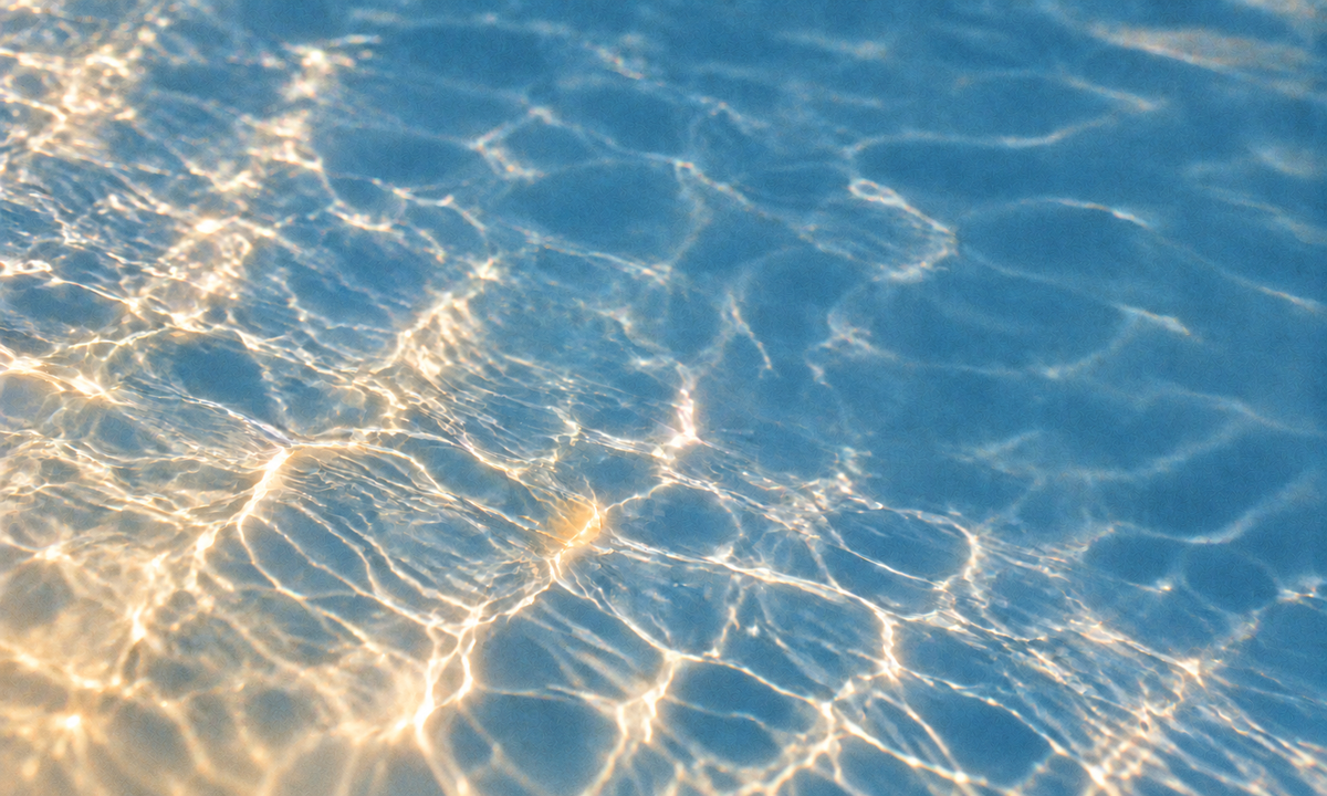 Sunlight on blue rippling water