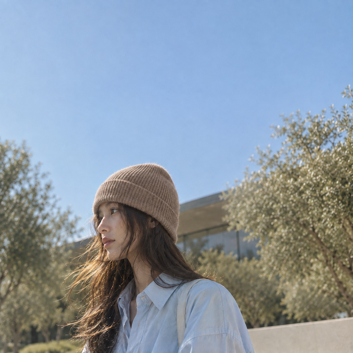 FRUAA Natural cashmere beanie worn outdoors in soft sunlight