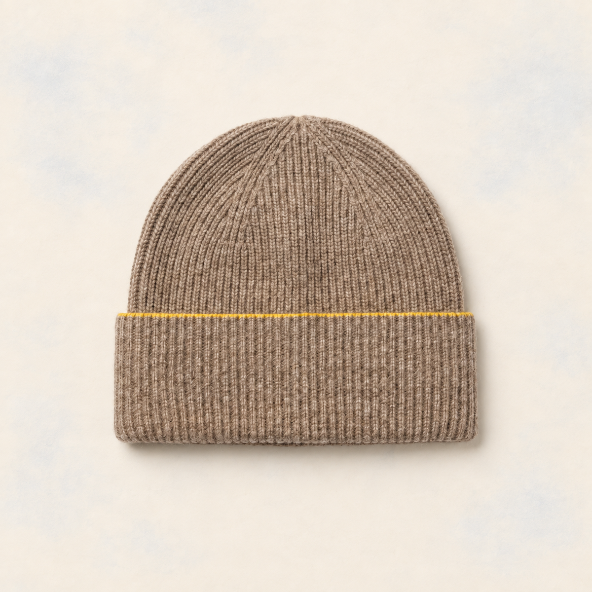 FRUAA Yellow Line cashmere beanie on a washed cream backdrop